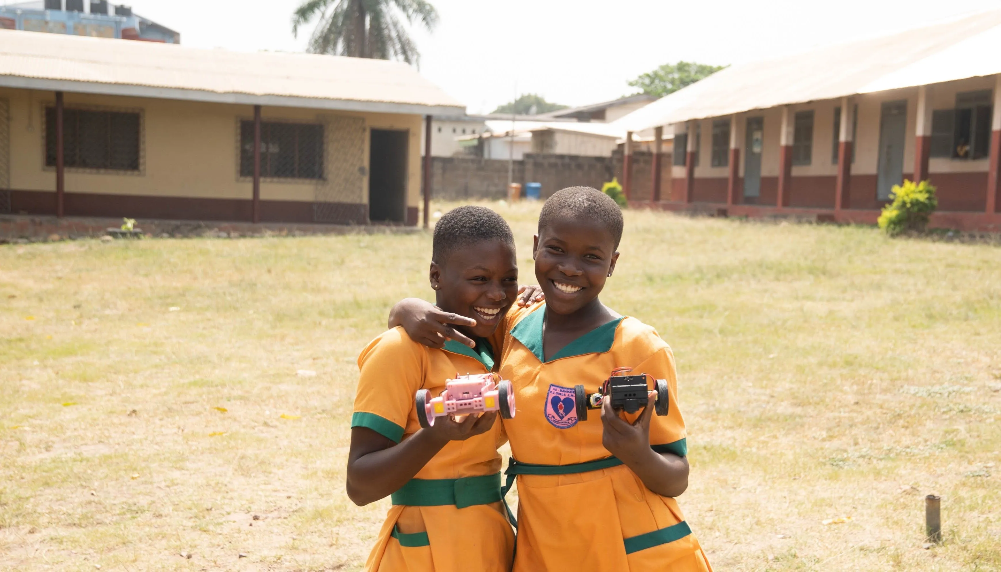 Students celebrating with robots